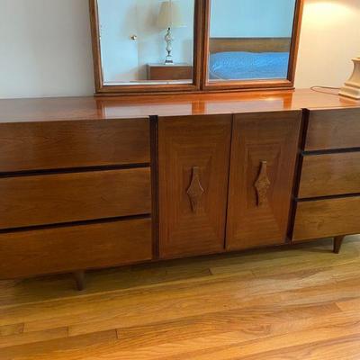 Lower mirrored dresser of 4 piece contemporary set.  76" tall, long, wide, 76" tall, and 20" deep. 