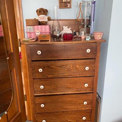 Dresser in upstairs bedroom.  Nice but has a small damage spot on lower drawer on right side lower