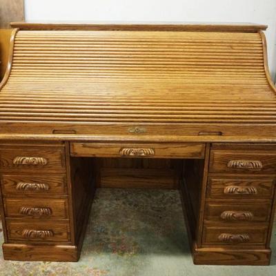 1077	CONTEMPORARY SOLID OAK ROLL TOP DESK W/CHAIR, DAMAGE TO CANING ON CHAIR SEAT, DESK TAMBOR STICKS, APPROXIMATELY 60 IN X 33 IN X 51...