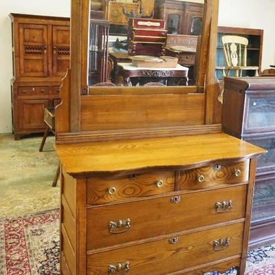 1075	SOLID OAK SERPENTINE FRONT CHEST W/MIRROR TOP & 4 DRAWERS, MIRROR HAS CRACK, APPROXIMATELY 42 IN X 20 IN X 78 IN HIGH
