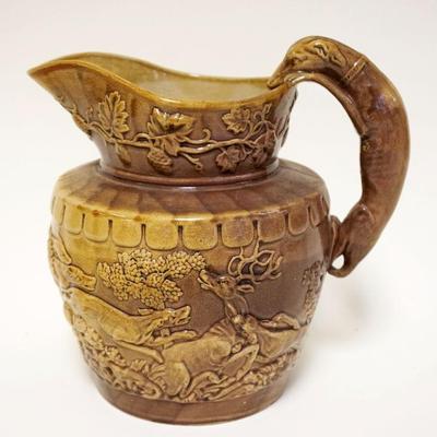 1007	ANTIQUE POTTERY HOUND HANDLED PITCHER, RELIEF HUNT SCENE OF DOGS, STAG & WILD BEAR, APPROXIMATELY 9 IN HIGH
