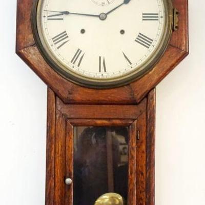 1023	ANTIQUE SETH THOMAS OAK CASE WALL CLOCK, APPROXIMATELY 16 IN X 32 IN HIGH
