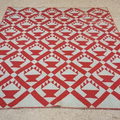 1039	ANTIQUE HAND SEWN QUILT W/RED FLOWER BASKET PATTERN, SOME WEAR, APPROXIMATELY 6 FT 6 IN X 7 FT 1 IN
