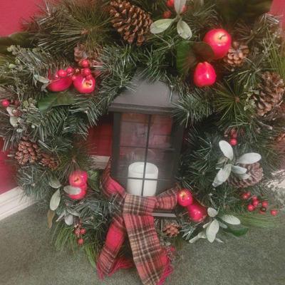 Christmas wreath with a lantern in the middle