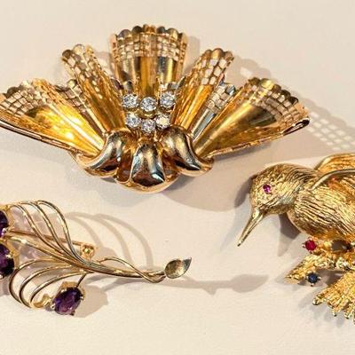 Selection of solid gold brooches