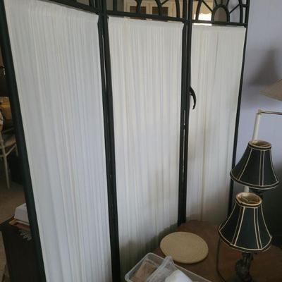 There are three of these, three panel, room dividers