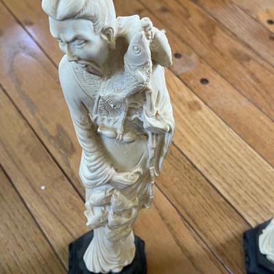 Vintage ivory resin fisherman figurine