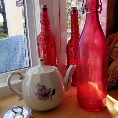 Teapot & red glass bottles