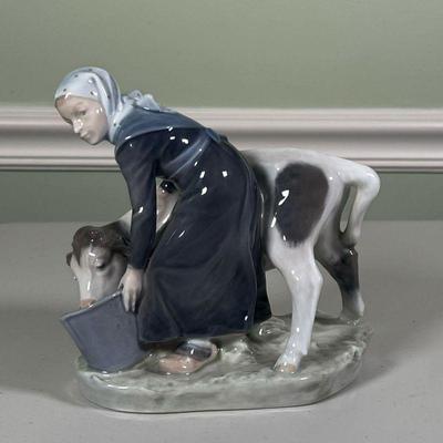 Royal Copenhagen Milkmaid |   Milkmaid and cow, no. 779 on the bottom
Dimensions: l. 7 x h. 6 in 
