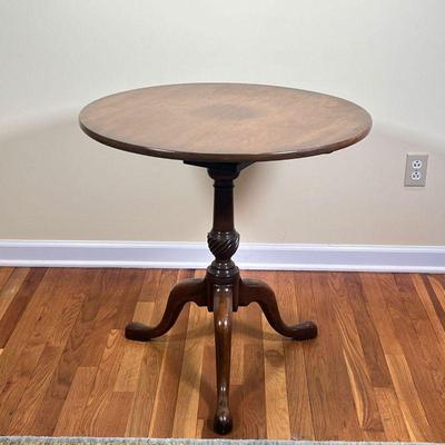 TILT TOP Round Table | Wood side table with bird cage base, Kittinger Buffalo label on underside
Dimensions: l. 28â€™ x h. 28â€™ in 