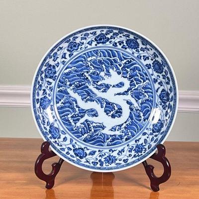 Blue & White Dragon Dish |  
Chinese blue and white porcelain dish with central dragon motif and dragon around the outer rim, no apparent...