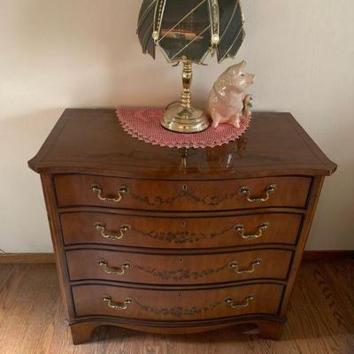 Antique Reproduction Linen Chest with flora decor on top and drawers.