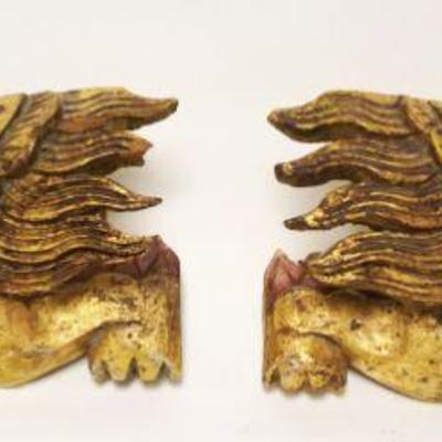 1090	PAIR OF CARVED WOOD WINGED FOO DOGS	PAIR OF CARVED WOOD WINGED FOO DOGS, APPROXIMATELY 4 IN X 9 IN
