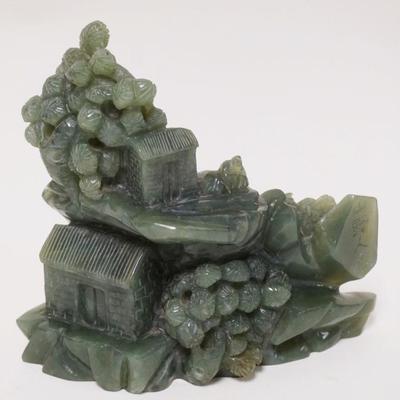 1020	JADE CARVING OF HUTS	JADE CARVING OF HUTS ON MOUNTAIN SIDE, CHARACTER SIGNED, APPROXIMATELY 7 IN X 6 1/4 IN HIGH
