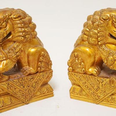 1135	PAIR OF CARVED GILT WOOD FOO DOGS	PAIR OF CARVED GILT WOOD FOO DOGS, APPROXIMATELY 6 IN HIGH
