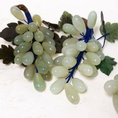 1198	LOT OF 4 ASIAN CARVED JADE GRAPE CLUSTERS	LOT OF 4 ASIAN CARVED JADE GRAPE CLUSTERS, APPROXIMATELY 9 IN LONG
