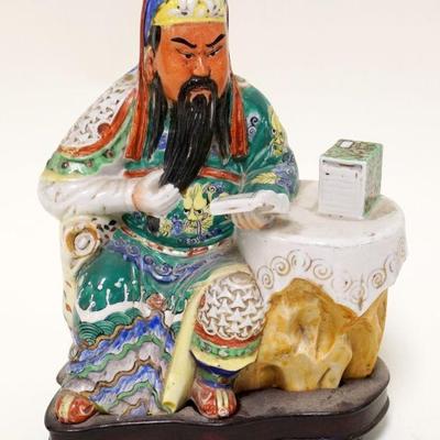 1027	ASIAN POTTERY STATUE	ASIAN POTTERY STATUE OF SEATED MAN READING ON WOOD STAND, APPROXIMATELY 9 IN HIGH
