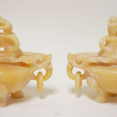 1112	2 CARVED SOAPSTONE COVERED VESSELS	2 CARVED SOAPSTONE COVERED VESSELS W/FOO DOGS, APPROXIMATELY 5 1/2 IN HIGH
