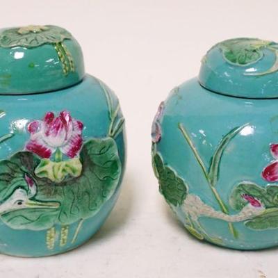 1159	2 ASIAN COVERED JARS	2 ASIAN COVERED JARS, APPROXIMATELY 5 IN HIGH
