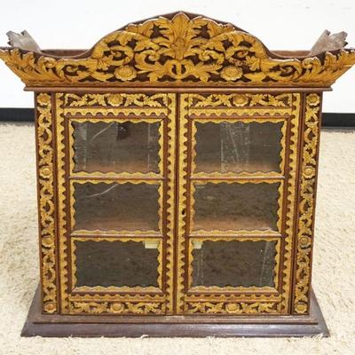 1057	ASIAN 2 DOOR CARVED GILT DECORATED CABINET	ASIAN 2 DOOR CARVED GILT DECORATED CABINET W/2 INTERIOR SHELVES, APPROXIMATELY 37 IN X 13...