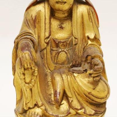 1044	CARVED WOOD GILT DECORATED ASIAN MONK	CARVED WOOD GILT DECORATED ASIAN MONK, APPROXIMATELY 11 IN HIGH
