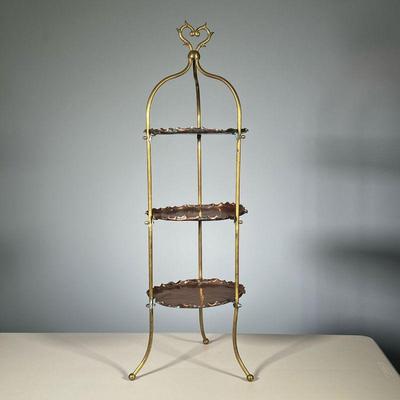 COPPER STAND | Three tiered copper stand with scalloped edges and a heart form carrying handle, on three splayed legs
Dimensions: h. 36.5...