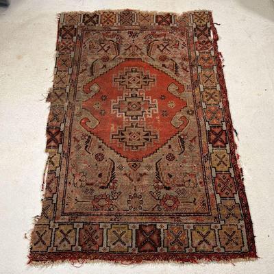 ANTIQUE CAUCASIAN RUG | Of small size, with central medallion
Dimensions: 64 x 39 in. 