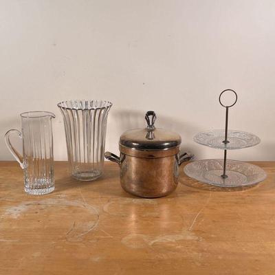 (4PC) GLASS & OTHER TABLE ITEMS | Including a silver plated ice bucket, a two tiered pressed glass dessert tray, a tall iced tea pitcher,...