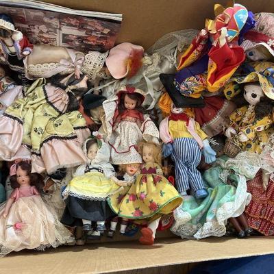 Box of vintage dolls and clothes