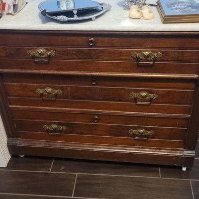 Another small chest of drawers