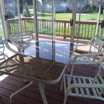 Glass top table 4 chair patio set
