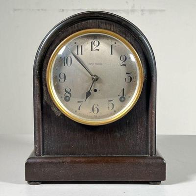 SETH THOMAS SHELF CLOCK | Movement made in USA, the face with Arabic numerals, housed in a wood case. h. 10 in  