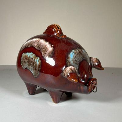 CERAMIC PIGGY BANK | Flambe glazed ceramic pottery coin bank in the shape of a pig, with a slot at the top to deposit coins and a hole in...