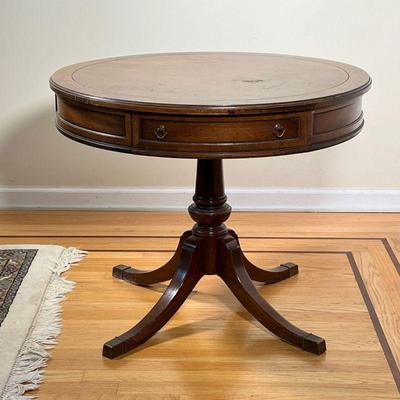 BRANDT FURNITURE DRUM TABLE | Having a single drawer on a quadruped base; h. 26 x dia. 32 in  