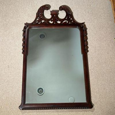 ANTIQUE WALL MIRROR | Fancy wood framed mirror crested by a fretwork broken pediment with bellflower carvings. w. 26 x h. 42 in  