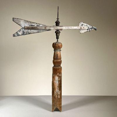 TIN COUNTRY WEATHERVANE | Tin and painted wood arrow-form weathervane. w. 20 x h. 25 in  