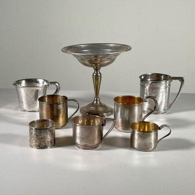(8PC) STERLING SILVER ITEMS | Including six variously sized childâ€™s cups (11.3 oz together approximately) plus a weighted sterling...
