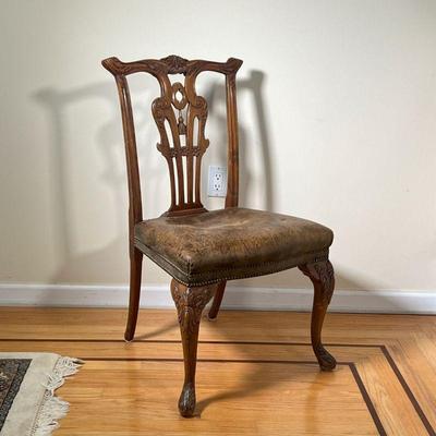 CHIPPENDALE STYLE ANTIQUE SIDE CHAIR | Chippendale style side chair with a leather upholstered seat and highly carved back splat 