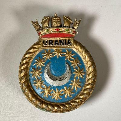 CAST IRON SHIPS BADGE | Painted cast iron ship badge with the name “Urania”. dia. 6 in  