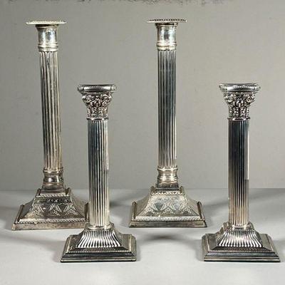 (4PC) TWO PAIRS SILVER PLATED CANDLESTICKS | Both of column form, including a pair with engraved bases (11 in); and a pair with...
