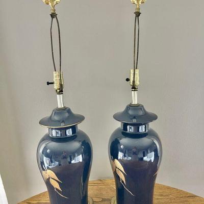 Lot 017-LR: Lamp Duo

Features: A pair of heavy, blue ceramic table lamps with gold decorative accents

Dimensions: 33â€H (base to top...