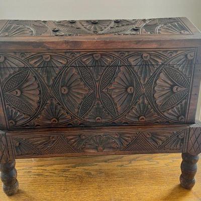 Lot 020-LR: Small Ornately-Carved Storage Chest

Features: Small (table-top) ornately carved storage chest on wood stand.

Dimensions:...