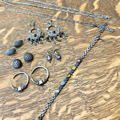 Lot 072-LOC: Silver and Gemstone Jewelry Assortment

Features: 
â€¢	A collection of silver and gemstone jewelry gathered as mementos from...