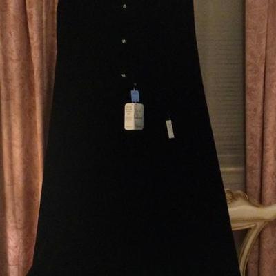 Black velvet floor length cape, still has original tags, was kept in garment bag