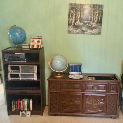 Stereo cabinet has storage for records, Hi-Fi console with radio and turntable works great, has record storage area.