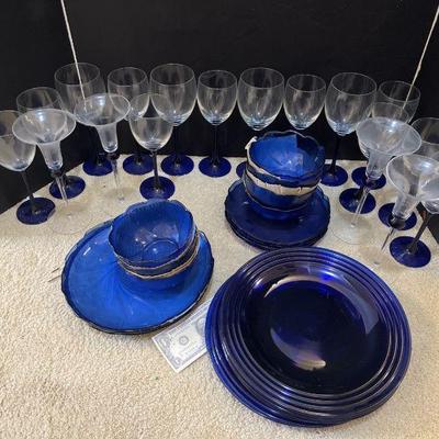 Blue plates , wine glasses, champagne flutes , bowls x7, plates 
