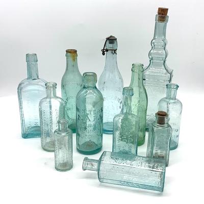 Antique aqua embossed bottle