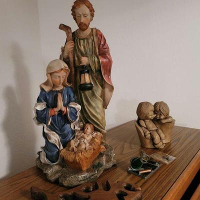 Religious figures and wall hanging