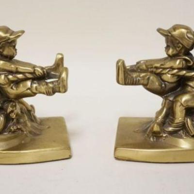 1209	BRASS BOOKEND, CHILDREN PLAYING TUG OF WAR, APPROXIMATELY 5 IN H
