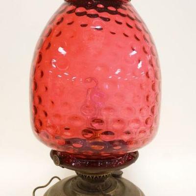 1018	LARGE VICTORIAN LAMPE VERITAS BRASS TABLE LAMP W/CRANBERRY SHADE, HAS BEEN ELECTRIFIED, APPROXIMATELY 23 IN HIGH
